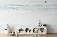 A peaceful surf scene mural on decorative wallpaper.

