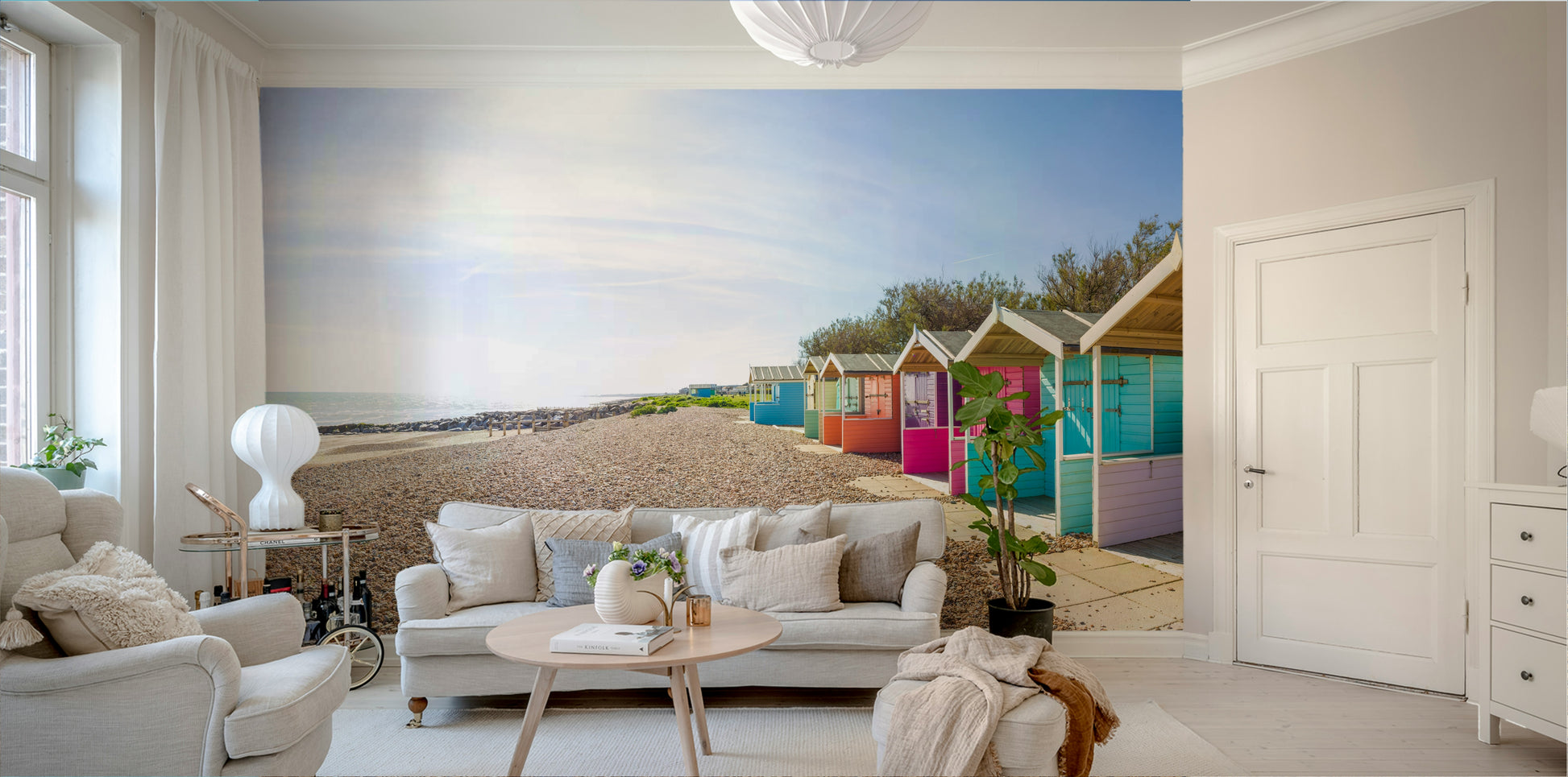 A beautiful coastal cabin wallpaper mural on a sandy beach.

