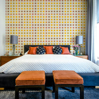 Modern wallpaper with playful mod-style dots in neutral and bright tones.