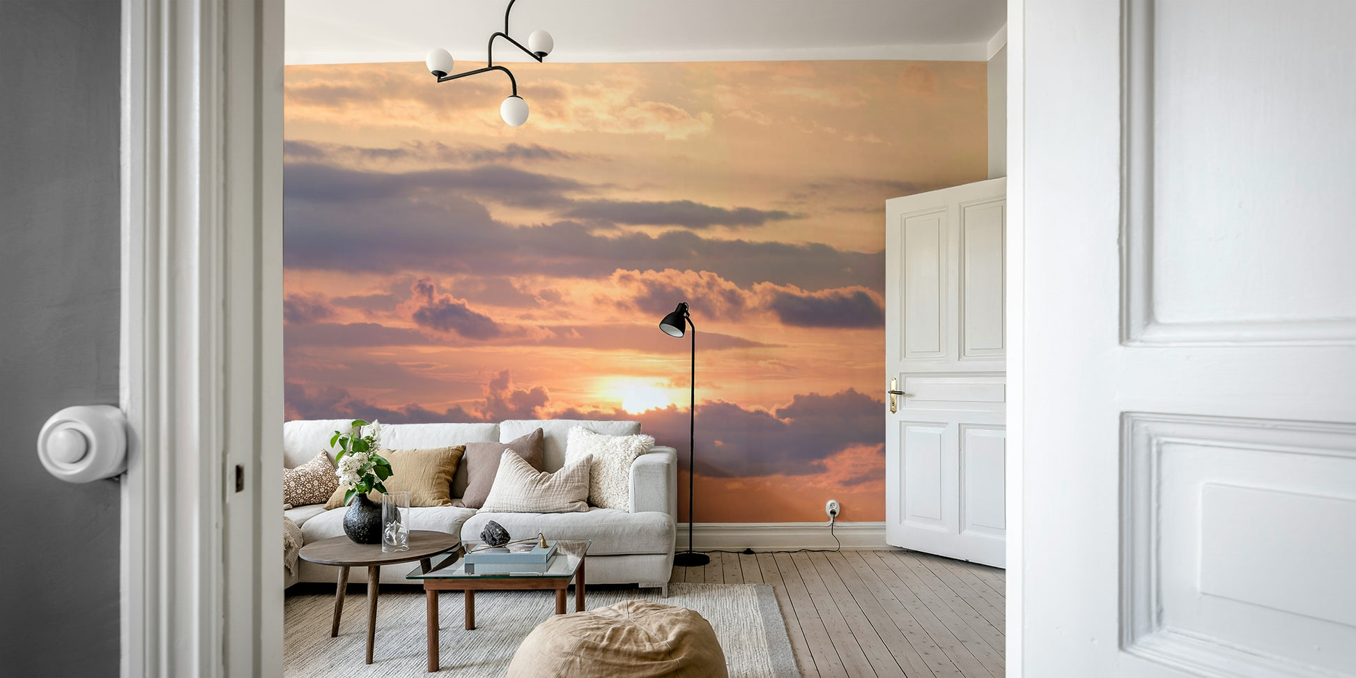 An artistic dramatic sunset mural on minimalist wallpaper.

