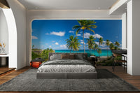 A beautiful palm-lined shore wallpaper mural with clear blue water.

