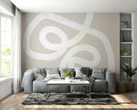 An artistic flowing line mural on minimalist wallpaper.

