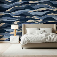 An artistic fluid pattern mural on minimalist wallpaper.