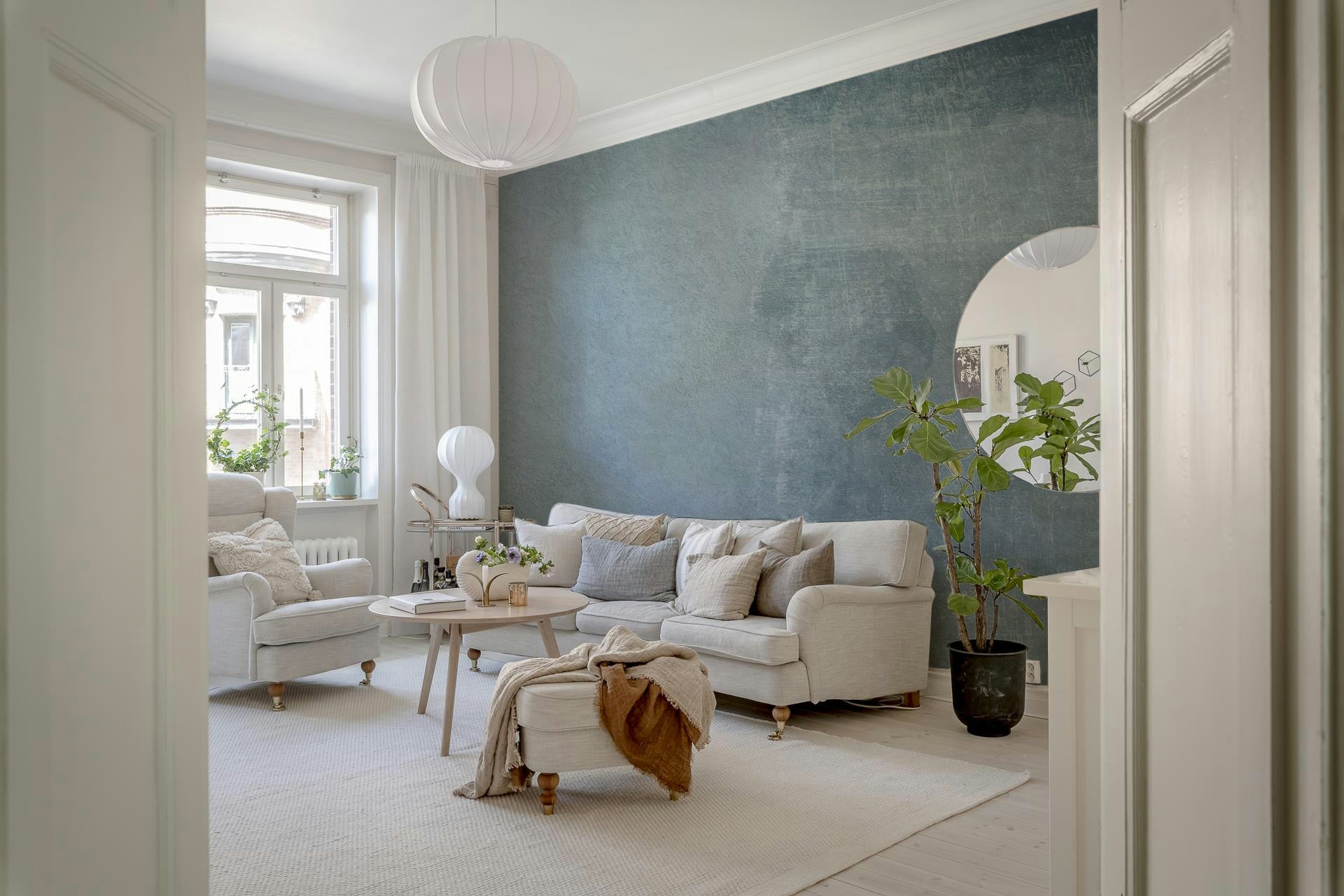 A calming abstract design wallpaper mural that defines a space.