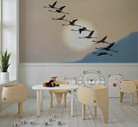 Sunset-inspired wallpaper with flamingos in flight creating a peaceful, natural scene.