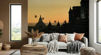 Balloons Over Bagan Wall Mural – Colorful hot air balloons soaring over ancient pagodas in a serene sunrise setting.