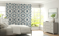 Modern geometric wall mural with layered triangles in navy, sky, and pastel blue tones.