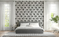 Decorative wall mural with intense staring eyes in grayscale for a dramatic effect.