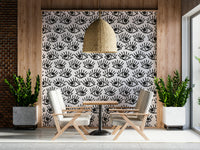 Decorative mural featuring layered black-and-white eyes creating a bold visual effect.