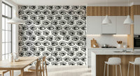 Wall mural with captivating staring eyes in monochrome tones for statement walls.