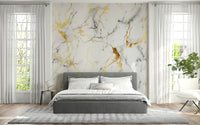 Decorative mural featuring swirling marble patterns accented with subtle gold shimmer.