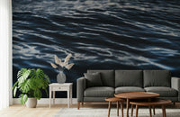 Decorative mural featuring fluid water ripples in rich, immersive blue tones.