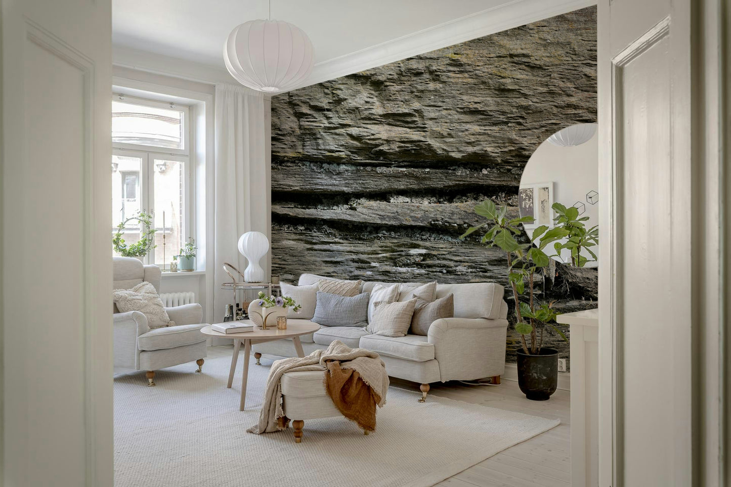 Textured wall mural with stacked stone layers creating depth and a rugged, authentic accent wall.