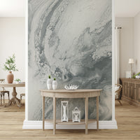 Textured mural with metallic silver swirl designs adding a sophisticated and artistic touch.