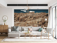 Natural landscape wall mural featuring terracotta cliffs, rugged terrain, and warm earthy hues.