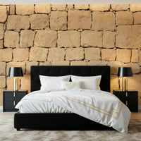 Earth-inspired wall mural with raw surface texture and warm tones creating a natural atmosphere.