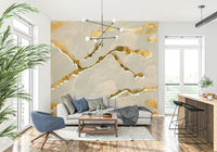 Detailed view of an ecru sand and gold abstract Marble Wallpaper, showing the luxe, swirling mineral pattern.