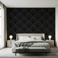 A stylish interior with the Black Charcoal Waves Wall Mural as a focal point, its dark, wavy pattern enhancing the room's geometric wallpaper theme.