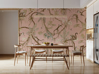 Tropical wall art with monkeys interacting amid pink and leafy greenery