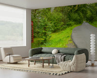 Panoramic mural of a remote asphalt road and a striking cultural landmark. British Call Box.