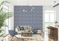Elegant leafy wallpaper with repeating floral silhouettes in calming neutral tones.