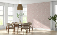 A soft pink wallpaper featuring repeated blooming flower motifs for a calming spring feel.