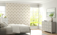 A warm beige wallpaper accented with minimal tropical palm shapes for a relaxed atmosphere.