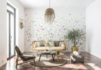 A light and airy wallpaper with hand-painted pastel flowers arranged in a gentle meadow pattern.