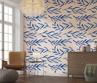Botanical wall mural with blue leaves and soft hand-drawn plant motifs.
