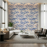 Nature-inspired wallpaper with blue flowers and leafy botanical elements.