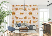 Soft radiant sun paired with smooth golden waves in a calming mural.