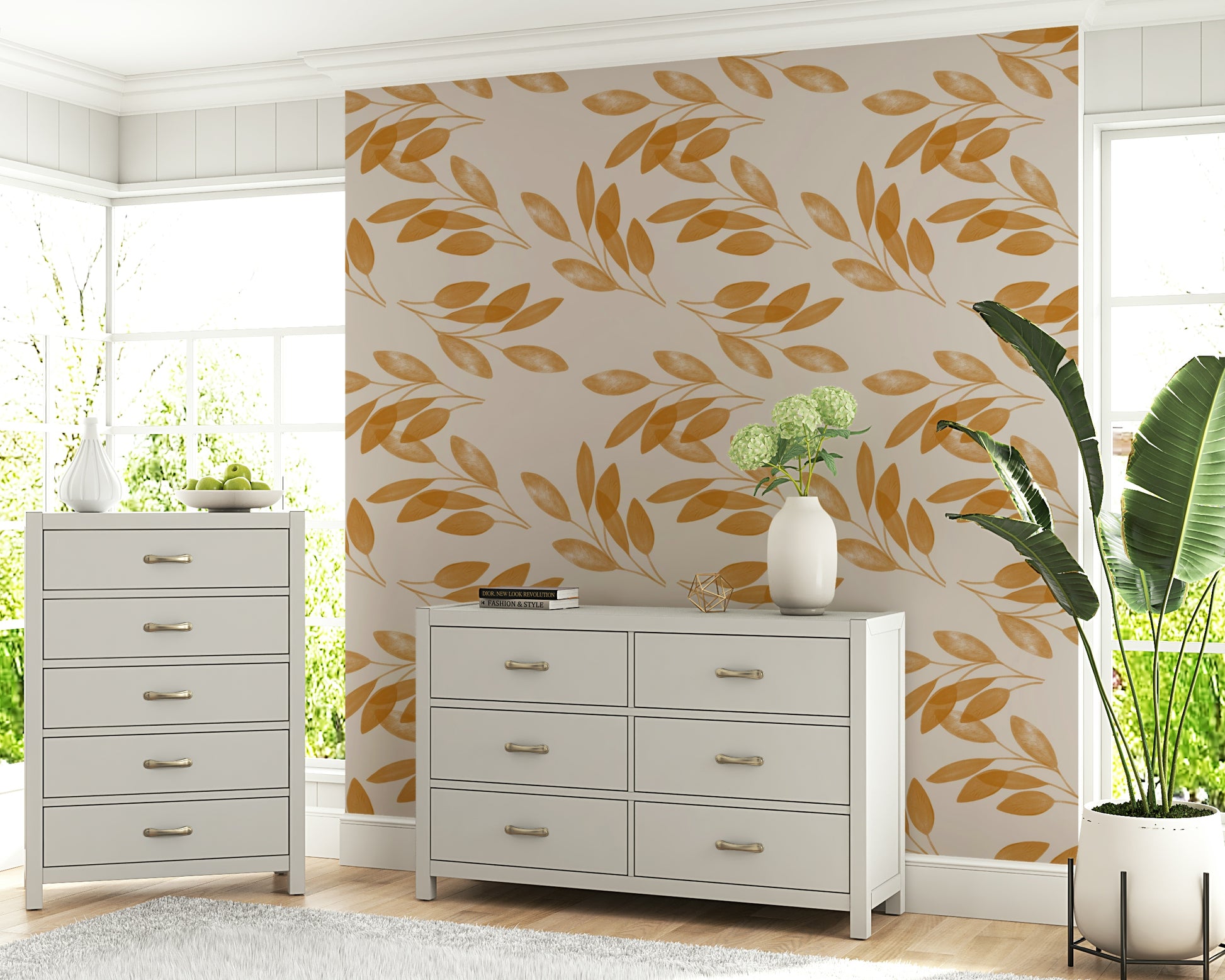A warm neutral wallpaper decorated with delicate golden branches and softly shaded leaves.