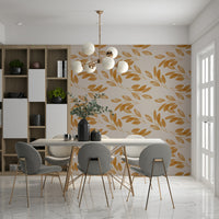 Elegant golden leaf motifs arranged in a gentle flowing pattern across this nature-inspired wallpaper.