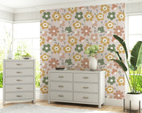 Soft pastel floral motifs arranged in a playful bohemian pattern across this charming wallpaper.