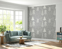 Delicate winter tree outlines in white creating a soothing festive wallpaper look.