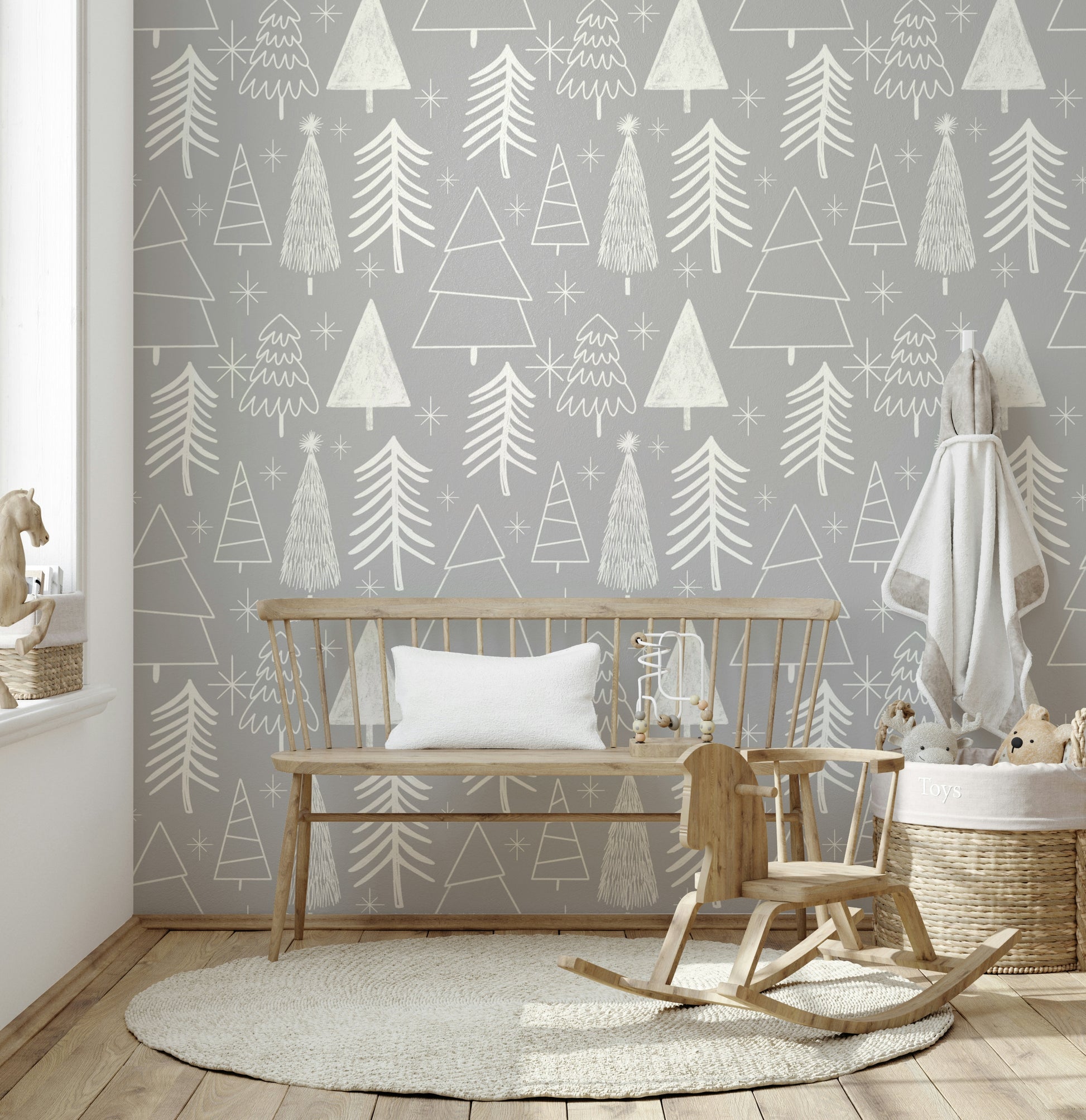 A peaceful wallpaper showing hand-drawn pine trees and star accents on a muted gray backdrop.