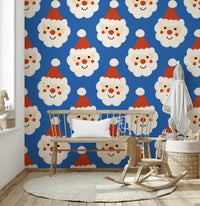 Blue holiday wallpaper covered in happy Santa faces with rosy cheeks and fluffy beards.
