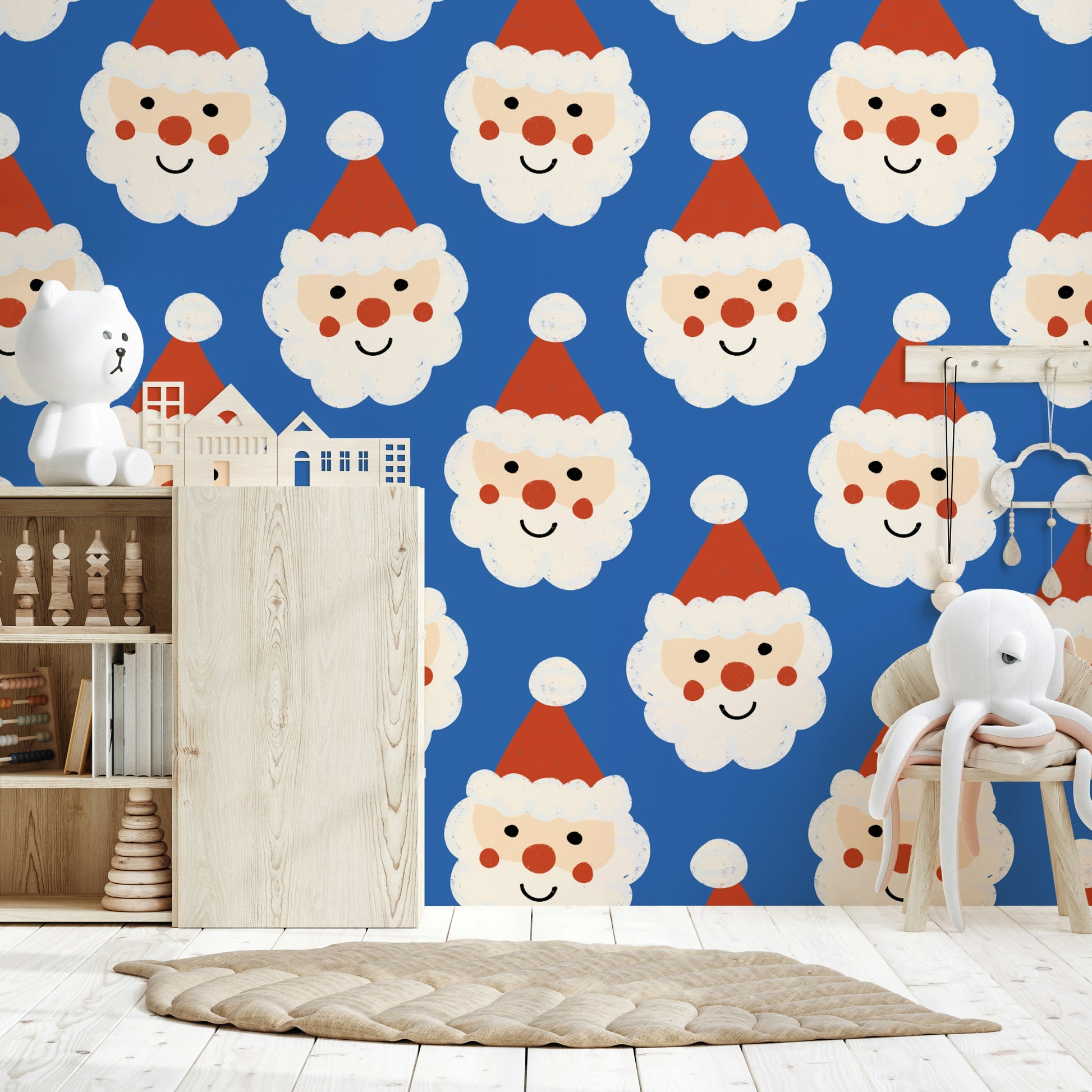 Playful holiday wallpaper with rows of jolly Santa faces wearing red hats on blue.