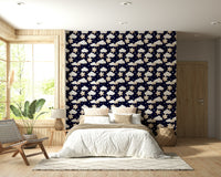 A navy wallpaper with repeating adorable stars and clouds creating a magical bedtime feel.