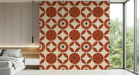 Warm mid-century wallpaper featuring circular floral shapes paired with leaf segments.
