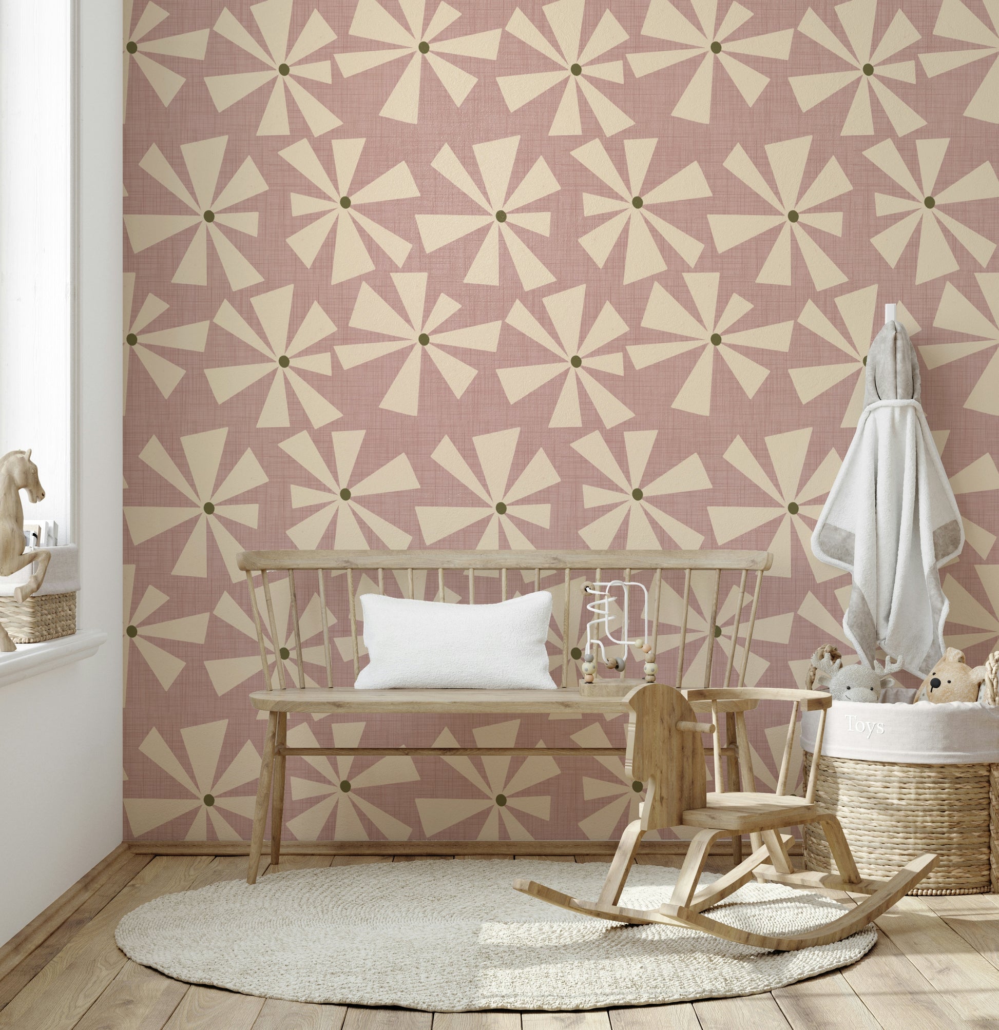 Retro floral wallpaper showcasing geometric starburst petals in a muted rose palette.