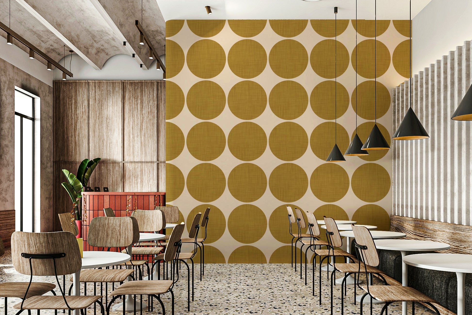Beige wallpaper decorated with large ochre dots that display a subtle fabric-like weave
