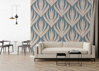 Decorative wallpaper mural with cream geometric floral elements over a muted blue backdrop.