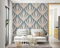Artistic wallpaper mural featuring stylized symmetrical leaf motifs on a muted blue grid texture.