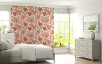 Romantic wallpaper mural with watercolor-style hearts scattered across a light neutral background.
