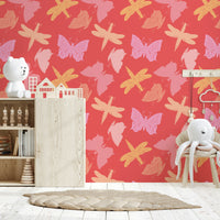 Butterfly Wings wallpaper featuring colorful illustrated butterflies in pink, yellow, and peach tones on a coral background.
