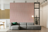Pastel pink gingham wallpaper offering a soft, airy checkered design.