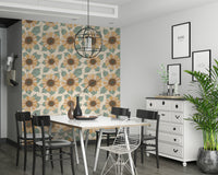 Patterned sunflower wallpaper with stylized yellow blooms and green leaves on a neutral base.