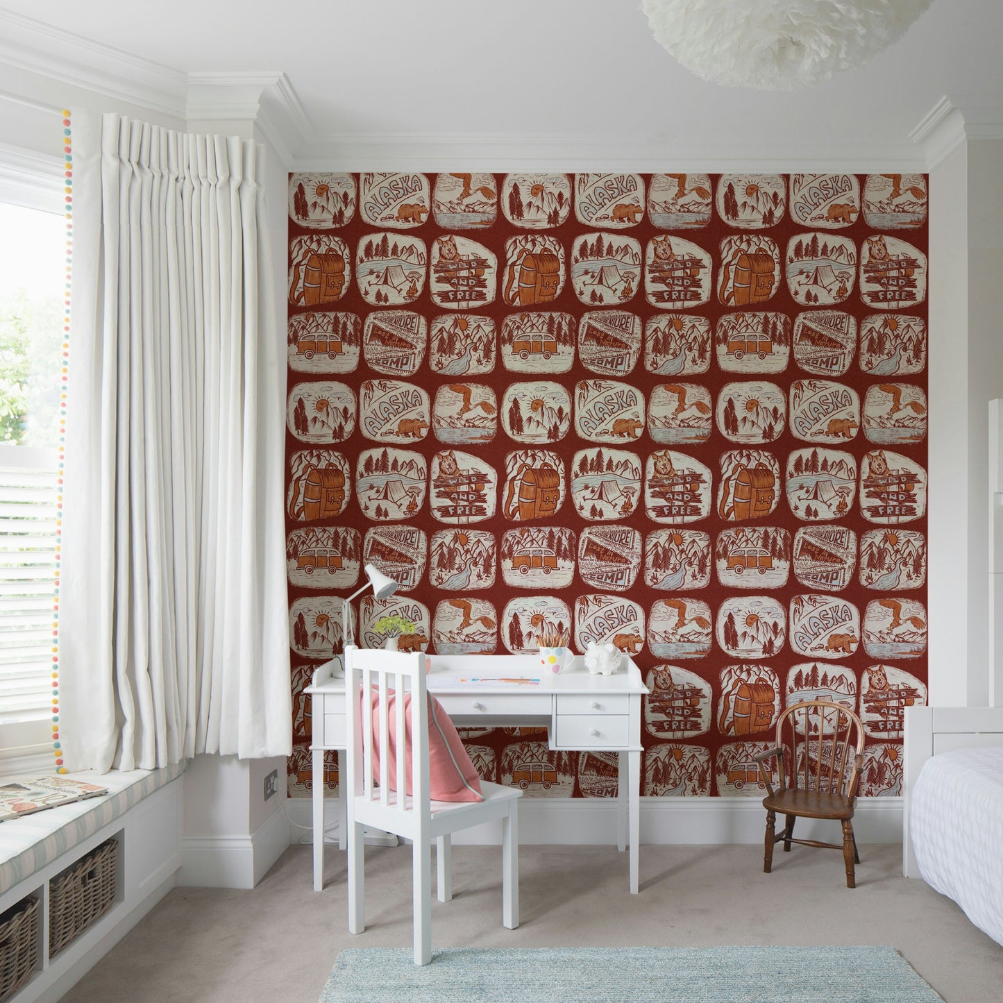 Rustic wallpaper mural showcasing hand-drawn wilderness patches in warm brown and cream tones.