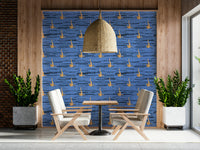 Artistic wallpaper mural with rhythmic water-inspired blue textures and warm golden details.